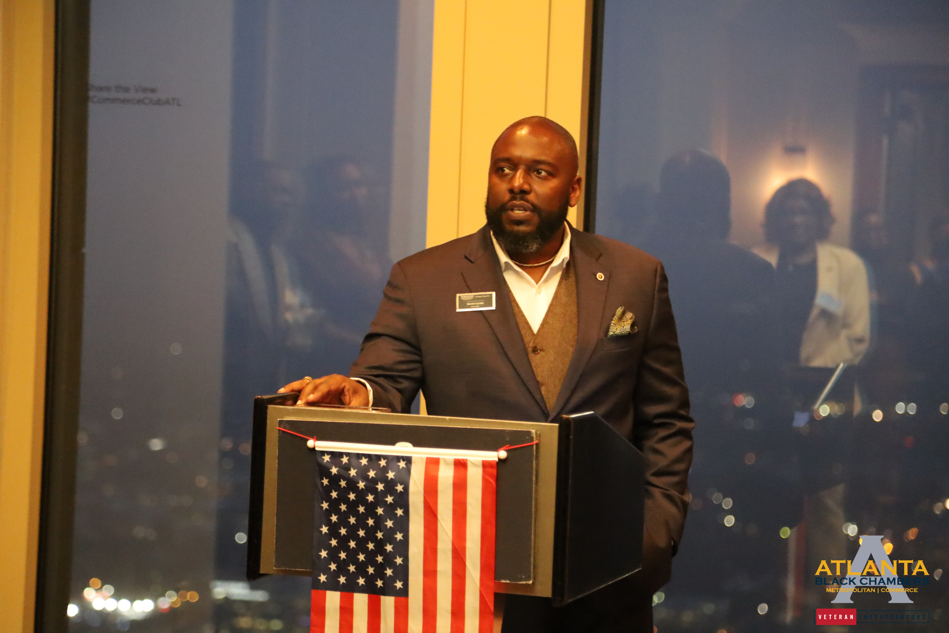 Dr. Nkosi Leary, USMC veteran and leadership consultant, delivering remarks at a Commerce Club Atlanta evening reception hosted by Atlanta Black Chambers